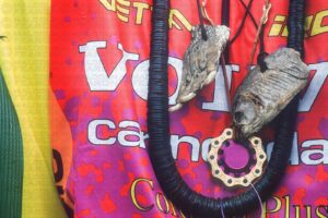 MISSY GIOVE NEW CROCODILE CLAW NECKLACE HANGS NEXT TO HER DRIED PET PIRANHA. HINDELANG GERMANY. GRUNDIG DOWNHILL WORLD CUP 1994