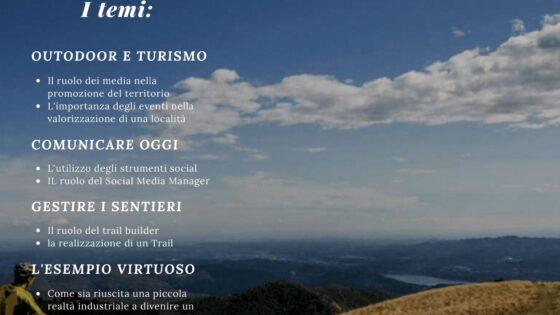 Mountain bike su un paesaggio collinare con cielo nuvoloso, persone che conducono un'attività outdoor, ambiente naturale.